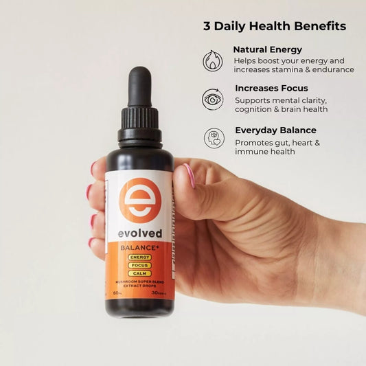 Clarity+ liquid extract held in hand, highlighting benefits including natural energy, focus, and balance.