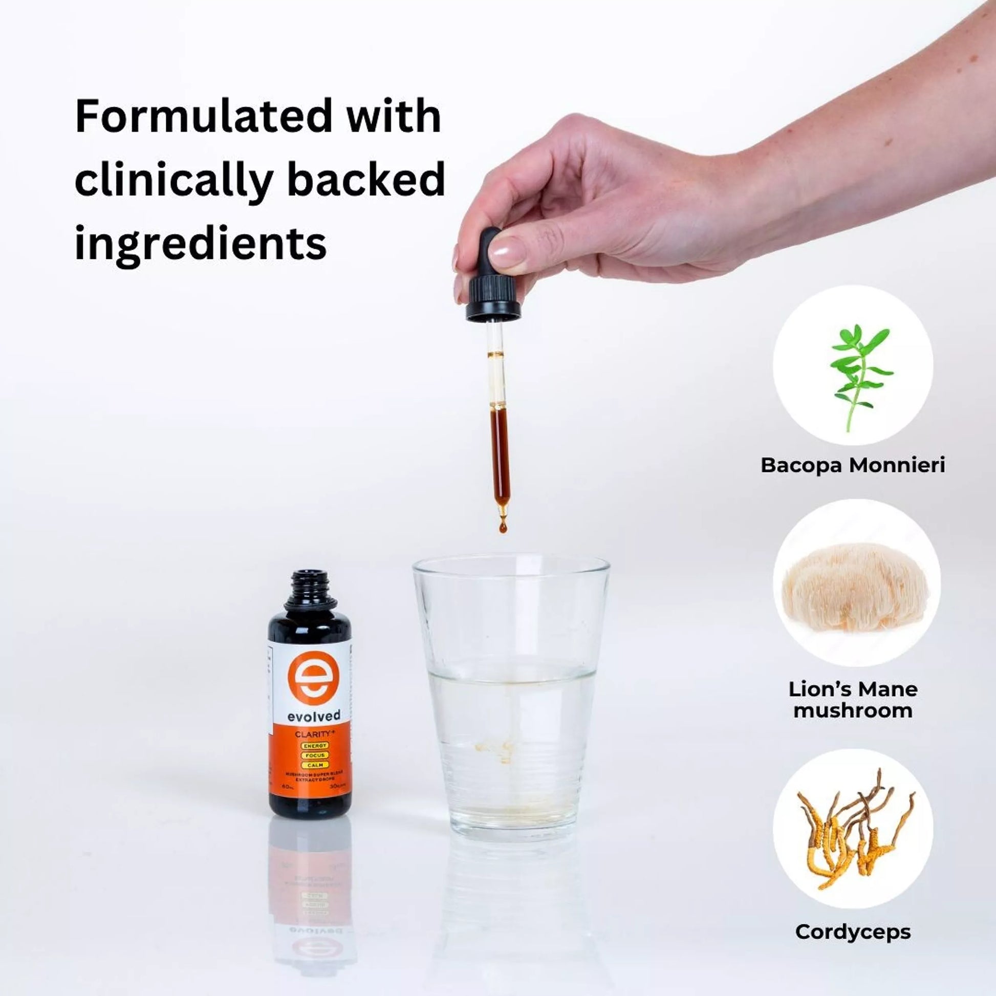 User adding Clarity+ extract to a glass of water with bacopa, lion's mane, and cordyceps in the background.